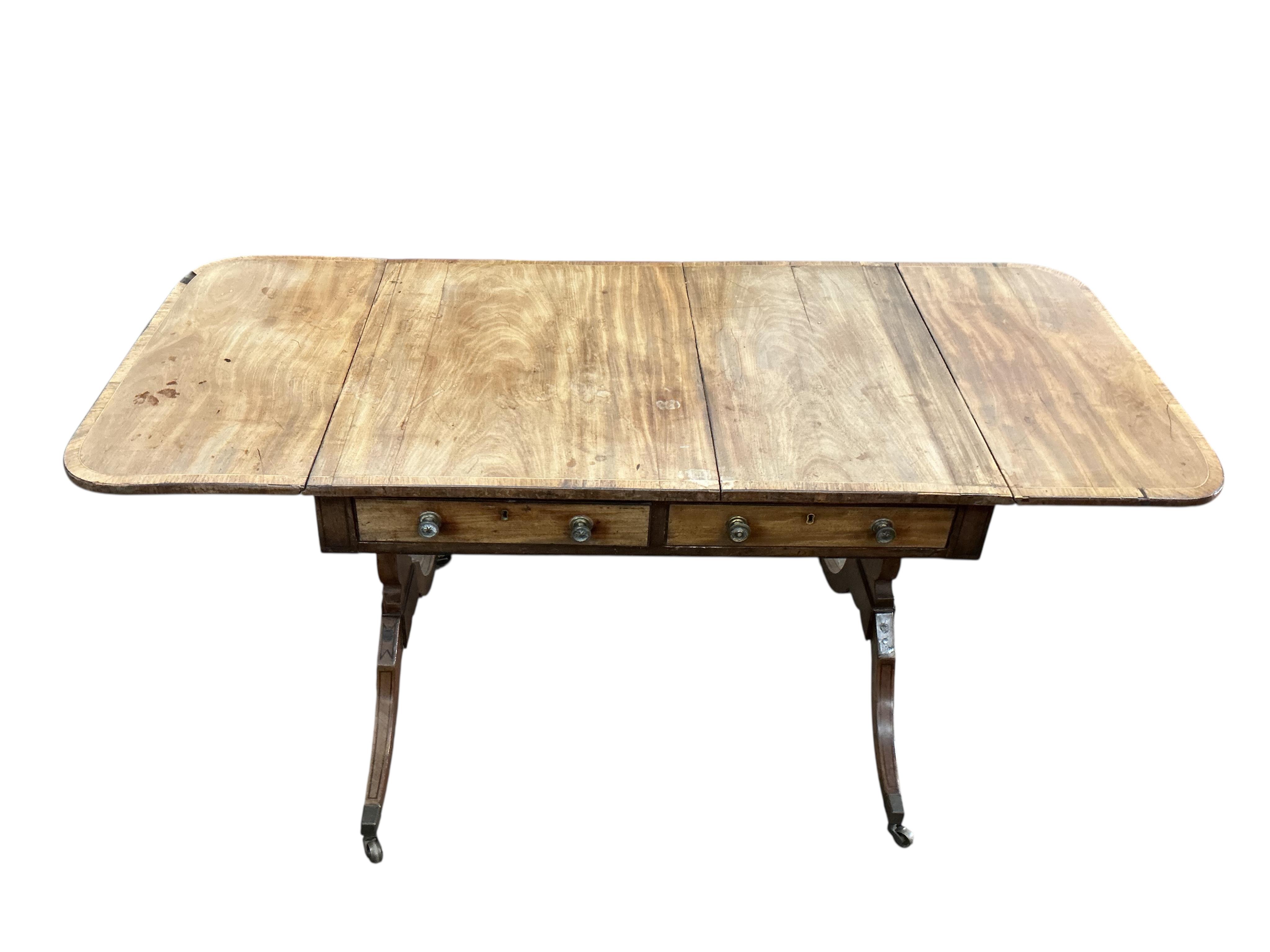 A Regency banded mahogany sofa table, damaged, width 89cm, depth 65cm, height 71cm